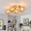 Nowoczesna lampa sufitowa Gastor z 4 bursztynowymi kulami na metalowych ramionach