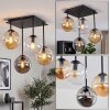 Lampa sufitowa Gastor z 4 szklanymi kloszami kulistymi nad stołem jadalnym
