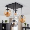 Lampa sufitowa Gastor z 4 szklanymi kloszami kulistymi nad stołem jadalnym